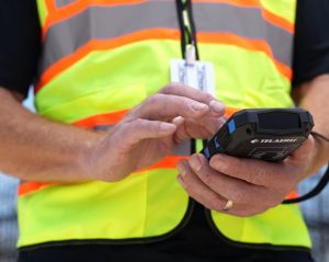 security officer with handheld reader