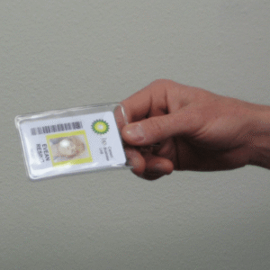 BP badge in a hand with a barcode printed on it